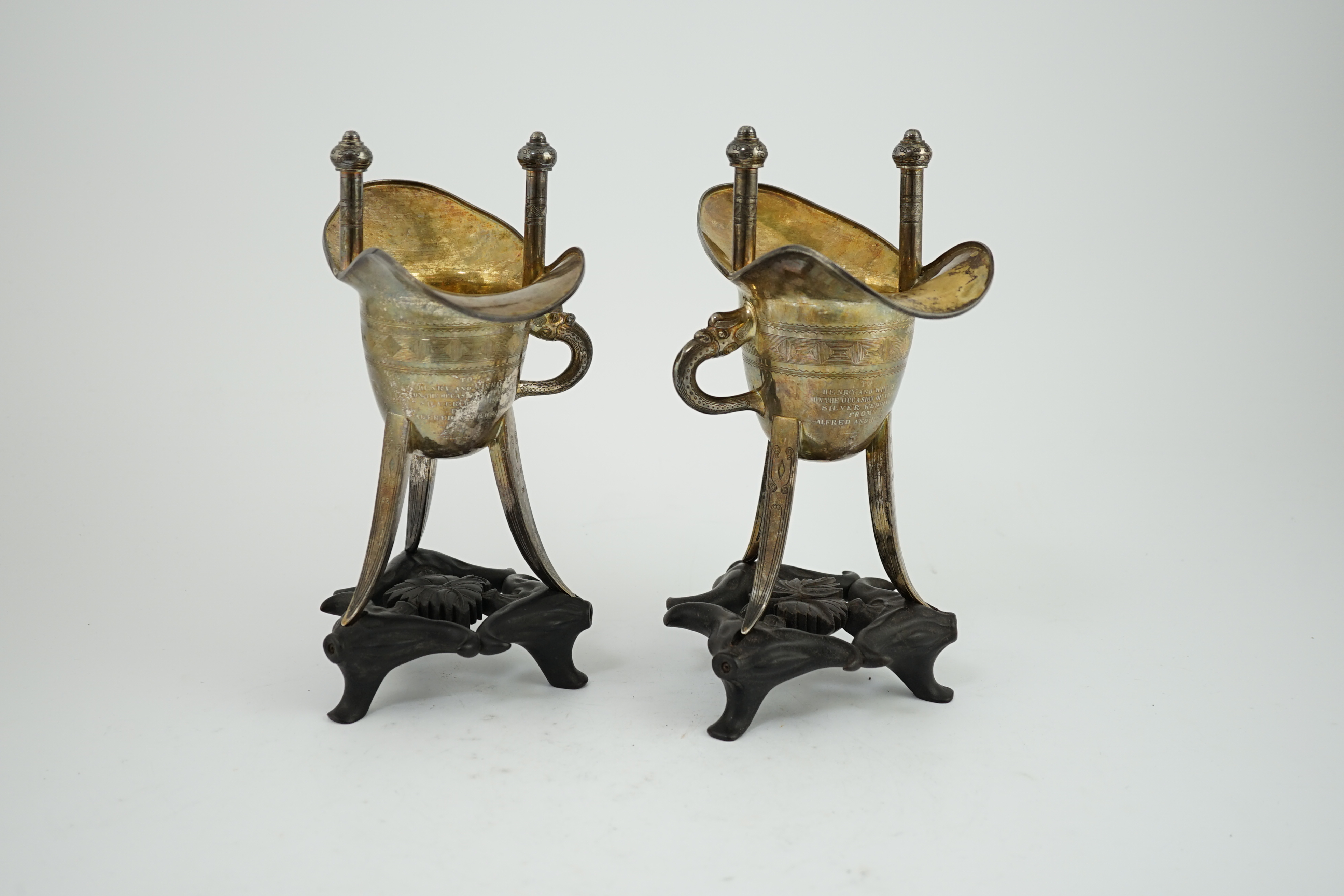 A pair of early 20th century Chinese archaistic silver 'Jue' wine cups, by Wang Hing, Hong Kong